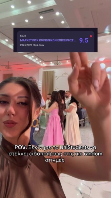Student at a party with a UniStudents grade notification on screen